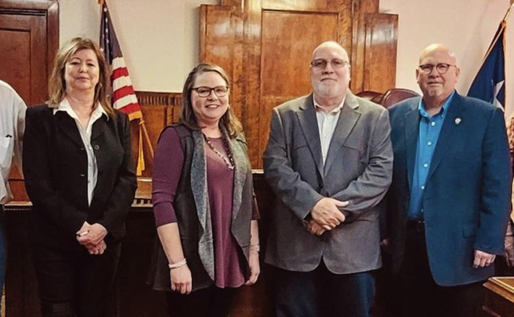 Collingsworth County Pct. 4 Commissioner Richard Johnson, left, County/District Clerk Jackie Johnson, Treasurer Gina Harris, County Judge Scot Martindale, Justice of the Peace Cliff Waller and Pct. 3 Commissioner Joel Sherwood recite their oath of office during a swearing-in ceremony at 2 p.m. Sunday, Jan. 1 in the Collingsworth County Courtroom. Courtesy Photos