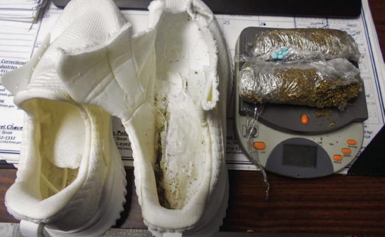 T.L. Roach Jr. Unit mailroom clerks discovered 76 grams of a green, leafy substance, believed to be K2, hidden in the soles of a pair of shoes, which was mailed to two inmates, Tuesday, Jan. 24. Photos Courtesy of the Texas Department of Criminal Justice