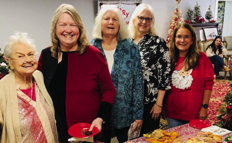Collingsworth County Museum Director Karen Caldwell, right, welcomes visitors Melba Hinson, left, and sisters, Doris Peters Wall, Linda Peters Brotherton and Karon Peters Sain, to a Christmas Open House Friday, Dec. 20. Guests flowed into the Ellis Art Center from 10 a.m.-2 p.m. for the warm fellowship, finger foods and hot Wassail and coffee. The Red River Sun/Bev Odom