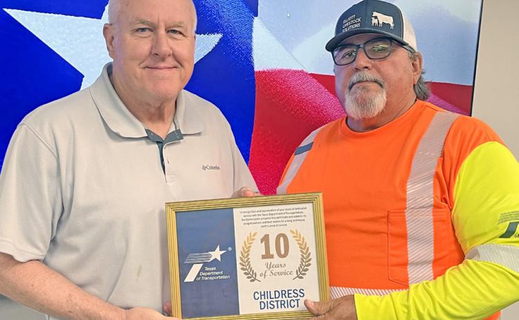 Texas Department of Transportation (TxDOT) Childress District Special Jobs Billy Hightower, right, accepts a 10year service award from TxDOT Childress District Engineer Darwin Lankford. Texas Department of Transportation