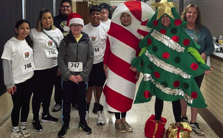 Participants line up prior to the Memphis Independent School District (ISD) Parent/Community Engagement Jingle Bell Run/Walk Saturday, Dec. 3 at Memphis High School. Memphis ISD thanks Blooms and Bolls, The Cottage, Fat &amp; Happy BBQ, Memphis Chamber of Commerce, Mimi’s Bakery, Morgan Jaynes Boutique, The Rock Inn Café, Sonic and Thriftway for the donation of door prizes. Photo Courtesy of Memphis ISD