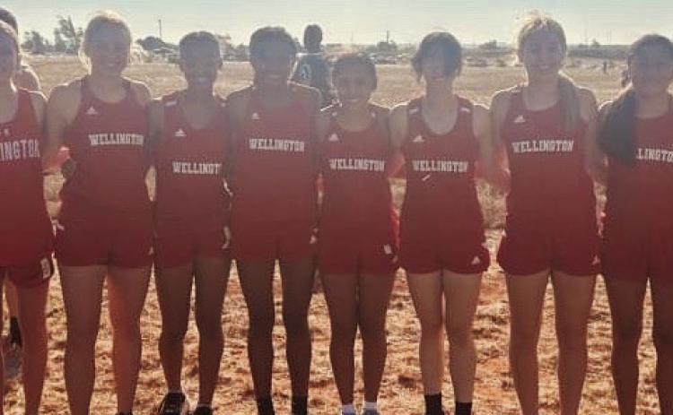 The Wellington Lady Rocket cross country team finishes as the first-place team champion during the Elk City Invitational Saturday, Sept. 30 in Elk City, Okla. Individual medalists included Addy Mock, sixth place; Harlee Gomez, 10th place; Sabrina Segovia, 12th place; and Presley Kane, 17th place. They are coached by Cade Brown. From left: Addalyn English, Elli Ouellette, Kane, Ayz’lin Menefield, Alyssa Lewis, Segovia, Mock, Gomez, Leslie Orozco and Ceighley Killian. Courtesy Photo