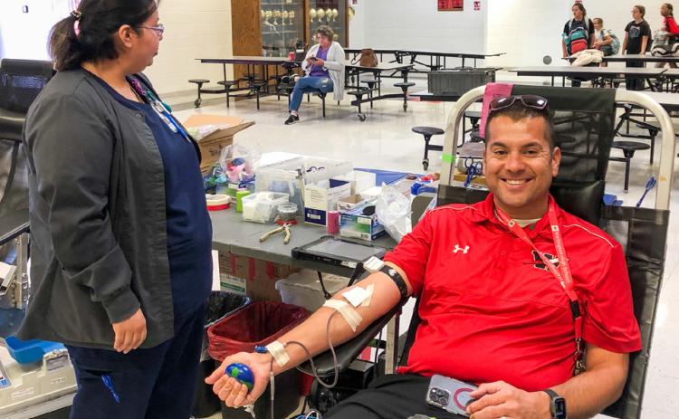Wellington High School (WHS) Principal Jermaine Cantu donates during Coffee Memorial Blood Center’s Blood Drive Thursday, Oct. 9 in the WHS commons. The Red River Sun/Bev Odom