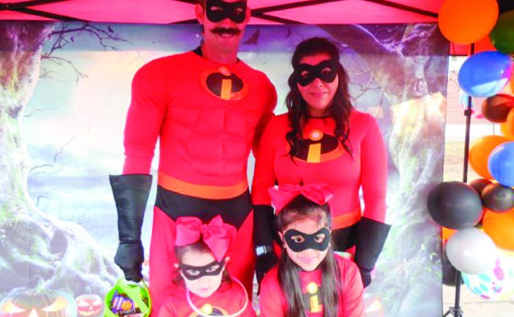 Kevin Long, dressed as Mr. Incredible, along with wife Monica Long and their daughters, Kobi and Kelbi, win the adult male category, earning $50. Photos by Memphis Chamber of Commerce