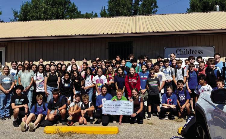 Childress Junior High School Leadworthy students present a $200 check to Childress Meals on Wheels Tuesday, May 20. Students raised funds by charging staff and students $1 to wear a hat on Friday, May 9. Childress Junior High School