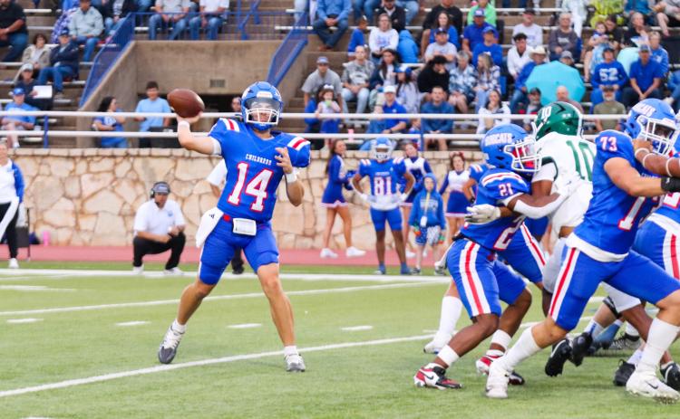 Childress quarterback Koen Galligan looks to make a connection with wide receiver Benton Sims during the Bobcats’ 21-14 win over Breckenridge Friday, Sept. 5 at Fair Park Stadium in Childress. Childress High School Yearbook