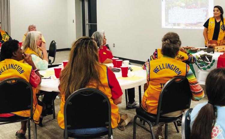 Maria Avalos, right, and Lion Noemi Pena encourage members of the Wellington Lions Club to embrace the colorful and beautiful diversity that Mexican Americans and all cultures bring to the United States. Avalos displayed kitchen items from Mexico that her mother uses daily. The Red River Sun/Bev Odom