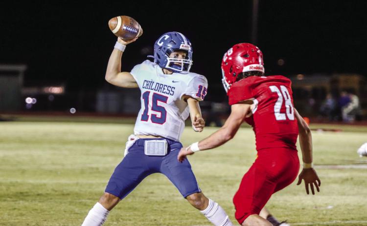 Childress quarterback Drake Rabe (15) searches for go-to wide receiver Isaiah Jalomo during the Bobcats’ win over the Friona Chieftains Friday night, Nov. 3 at Chieftain Stadium. Photos by Childress High School Yearbook Staff