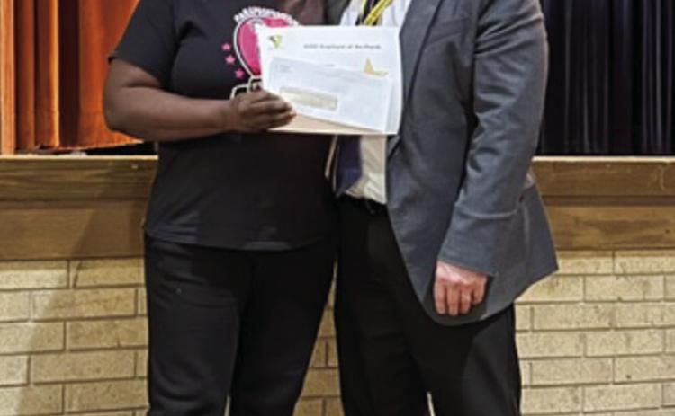 Memphis High School paraprofessional Tammy Henderson, left, is named the March Memphis Independent School District (ISD) Employee of the Month by Memphis ISD Superintendent William Alexander. Photos Courtesy of Memphis ISD