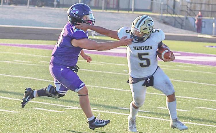 A Memphis Cyclone tries to fend off a Benjamin defense player last week during the six-man season opener. Memphis will face Follett Sept. 4 and then Vernon JV on Sept. 9, both games will be on the road.