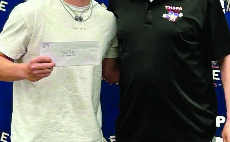 Childress senior powerlifter Reid Felton, left, is awarded the Texas High School Powerlifting Association (THSPA) Region 1 Division 3 Scholarship at the recent THSPA State Championship Friday, March 24 in Abilene. Courtesy Photo