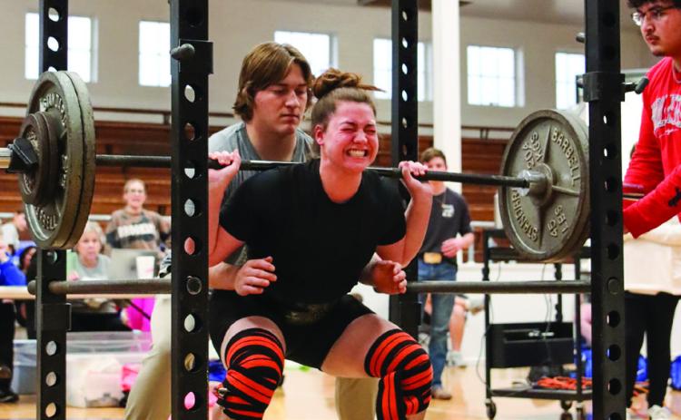 Childress’ Kennedy Smithwick squats 240 pounds, putting towards her 665-pound total, which won weight class 181. Photo by Childress High School Yearbook Staff