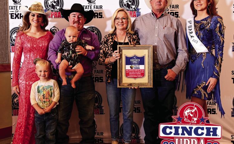 Cottle-King Old Settlers Reunion and Rodeo President Dana Wright and Rodeo Director Frank Wright accept Most Improved Rodeo of the Year by the United Professional Rodeo Association (UPRA) during the UPRA Finals Rodeo and Awards held Saturday, Oct. 22 the State Fair of Texas in Dallas. From left, 2022 Miss UPRA Ashlyn Williams, Champion Rodeo Company stock contractor National “Nate” Champion along with sons Reinen and Ropen, Dana Wright, Frank Wright, 2023 Miss UPRA Aspen Wash. Courtesy Photo