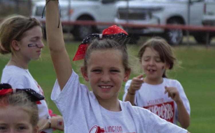 Skyrocket mini cheer campers shout football victory vibes