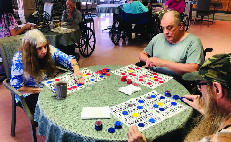 Wellington Care Center Activity Director Thalia Herrera calls a competitive game of bingo during a recent afternoon in the dining room of the facility. Regardless of the activities offered, certain residents never pass up an opportunity to play bingo. The Red River Sun/Bev Odom