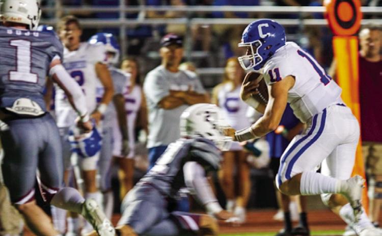 Childress quarterback Scout Smith (11) dodges opponents as he runs the ball during the Bobcats’ 49-22 win over Bowie Friday night, Sept. 23 at Jackrabbit Stadium. The Red River Sun/Nicole Dill