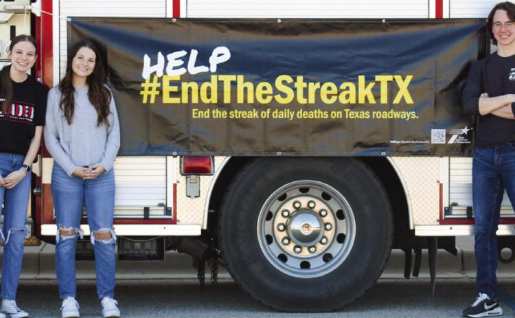 Family, Career and Community Leaders of America (FCCLA) members Kara Palomo, Meg Ridens and Darren Pratt host a Traffic Safety Fair in conjunction with the Texas Department of Transportation (TxDOT) Monday, Nov. 7 at Childress High School. The Red River Sun/Elizabeth Tanner