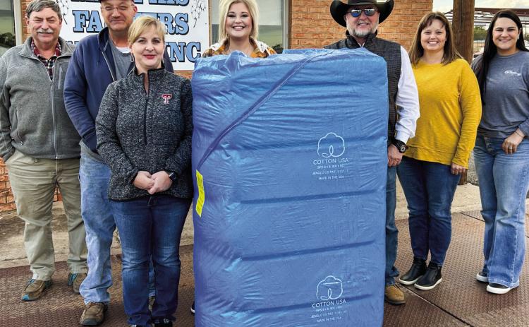 K&amp;W Farms brings in the first bale of cotton at Memphis Farmers Gin on Wednesday, Nov. 2. From left, Memphis Farmers Gin Manager Jamie Snider, K&amp;W Farms’ Wade and Kitzy Pepper, K. Huddleston Sales’ Kristen Altman and Kevin Huddleston and Fowler Agency’s Melody Middleton and Kate Woods. Photo Courtesy of Memphis Farmers Gin