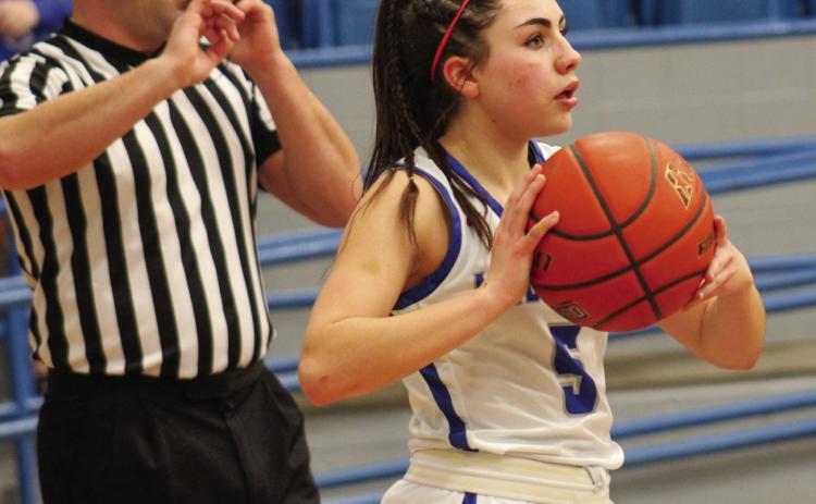 Lady Cat Aspen Lomax passes the ball during a 62-26 win over Slaton Friday, Jan. 27 in Childress. The Red River Sun/Elizabeth Tanner