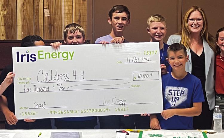 Childress County 4-H club officers accept a check in the amount of $10,000, which was granted through the Iris Energy Community Grant Program and presented by Iris Energy Community and Employee Relations Manager Nicole Dill at the recent Childress County 4-H meeting Tuesday, Oct. 11 at the Fair Park City Auditorium. For more, see page 7B. The Red River Sun/Nicole Dill