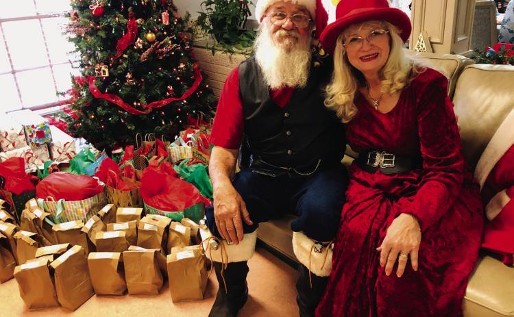 Santa and Mrs.Claus visit Wellington Care Center