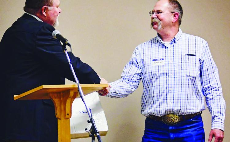 Collingsworth County District Conservationist Robert Self, right, receives congratulations from United Sates Department of Agriculture-Natural Resource Conservation Service Assistant State Conservationist Chad Reed at the Texas Soil and Water Board’s annual awards banquet. Courtesy Photo