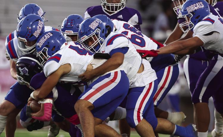 The Childress Bobcats swarm the Dimmitt ballcarrier Friday, Oct. 25 at Bobcat Stadium in Dimmitt. The Red River Sun/Nicole Dill