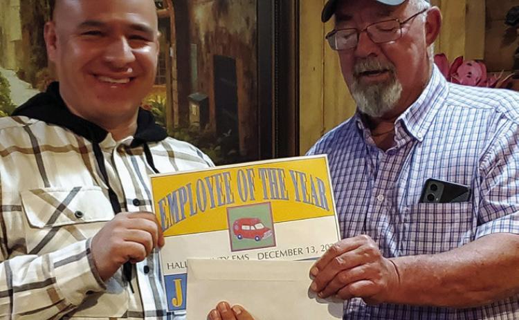 Hall County Emergency Medical Services’ (EMS) Nick Narvaez is awarded Employee of the Year, presented by Hall County EMS Director Jace Francis, Saturday, Dec. 14 during Hall County EMS’ Christmas party. Photos Courtesy of Hall County EMS