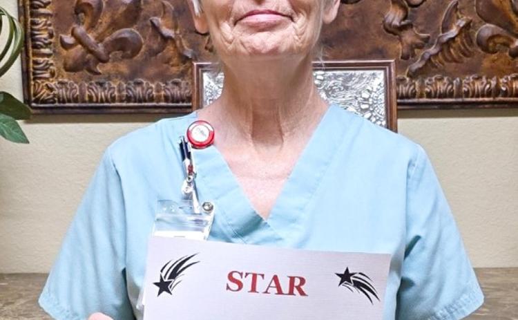 Sarah Jett, Licensed Vocational Nurse and Swing Bed Coordinator, accepts the STAR (Service, Teamwork, Attitude and Results) distinction for the third quarter of 2025 for going above and beyond, advocating for Collingsworth General Hospital patients and seeking the best possible care for the patients. Collingsworth General Hospital