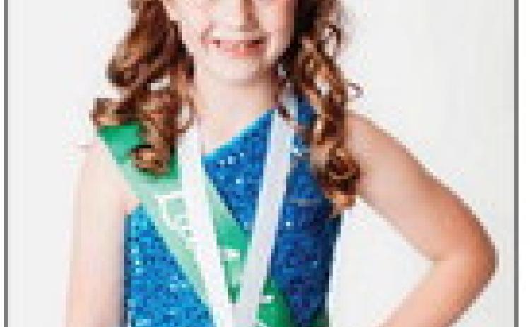 Wellington Elementary School second-grader Saige Coyne is the 2026 Little Miss Lassie, announced Sunday, March 19 during the Little Miss Lad N’ Lassie Pageant at Shamrock High School. “My favorite person, in the whole world is Jesus, because he died on the cross to save our sins,” replied Saige in response to an on-stage question asking who her favorite person in the whole world is. Passionate about church, Saige captured the crown, telling everyone about Jesus. Nicole Yarbrough Photography