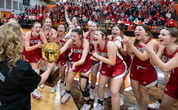The Wellington Lady Rockets celebrate with the Class 2 area round gold ball after beating Panhandle 41-38 on Friday night, Feb. 16 at the Caprock Activity Center. Press Pass Sports/Joe Garcia III