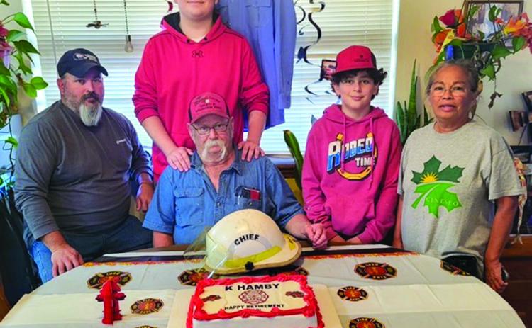 Surrounded by his family, Kevin Hamby, center, celebrates his retirement from the Wellington Volunteer Fire Department, where he served for 38 years. Through the years serving his community, Hamby took on the role of fire chief. His most memorable moment is when the fire station burned in 1995. From left: Hamby’s son, Jonathan Hamby; grandsons Tristan Hamby and Jeremiah Hamby; and Hamby’s wife, Eva Hamby. Courtesy Photo