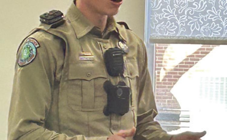 Texas Game Warden for Childress and Hall Counties Zach Fisher explains his responsibilities to the Collingsworth County Retired School Personnel. Fisher has taken nine twoweek shifts, serving as law enforcement patrolling the Texas border.