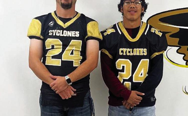 Senior Dominik Castillo swaps with Christian Brooks.