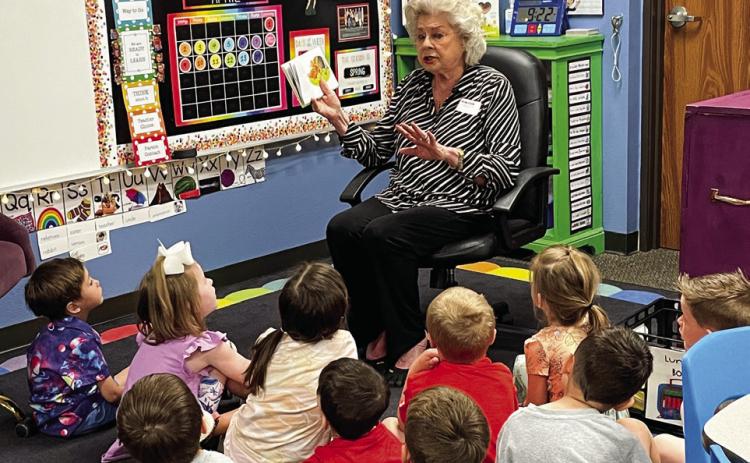 Collingsworth County Retired School Personnel Association (CCRSP) member Vada Wood reads to Megan Wischkaemper’s pre-kindergarten students Friday, April 14. An annual event, members of CCRSP donated books so that each student in Head Start, pre-kindergarten and kindergarten received a book to take home. Courtesy Photos