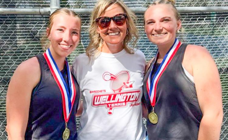 Senior Lady Rocket cousins Brynlee Proffitt, left, and Oakley Folk, right, gather with Coach Amy Inman to celebrate the recent girls’ doubles district championship. Wellington High School