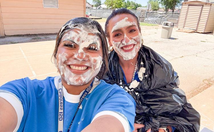 Childress Elementary School students cash in their classroom bucks — earned through an incentivized behavioral award system — to pie their teachers, Samantha Juarez and Lauren Reed, Monday, May 11. CHILDRESS ELEMENTARY SCHOOL