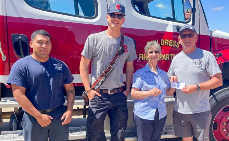 Modern Home Club’s Linda Gooch presents a donation to the Childress Fire Department. From left: Childress Fire Department firefighters Julio Olivares and Sean Curtis, Gooch, Childress Fire Department Chief Ralph Freeman. MODERN HOME CLUB