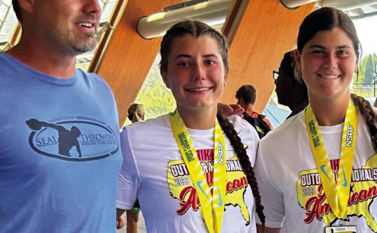 Childress High School sophomore Taylor Wiseman, center, competes in the National Scholastic Athletics Foundation (NSAF) 2023 Nike Outdoor Nationals, snagging a fifthplace finish in discus with a 147-10 throw. Courtesy Photo