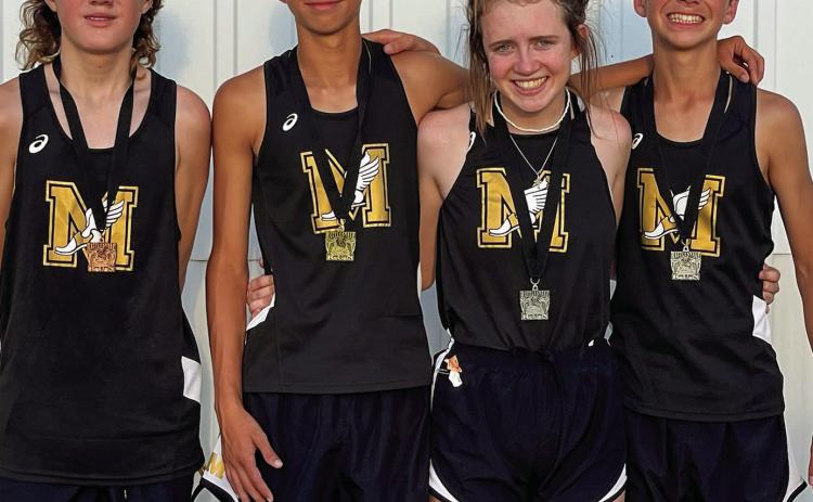 Four Cyclone cross country runners, including Ethan McAllister, left, Ryder Robison, Braylee Brooks and Kyler Robison, medal at the recent 18th Annual Rattlesnake Run, held Tuesday, Sept. 13 in Guymon, Okla. K. Robison finished 18th in the junior high division, while McAllister finished 15th in the junior varsity division. In the varsity division, R. Robison finished third, while Brooks finished 11th. Photo Courtesy of Memphis ISD