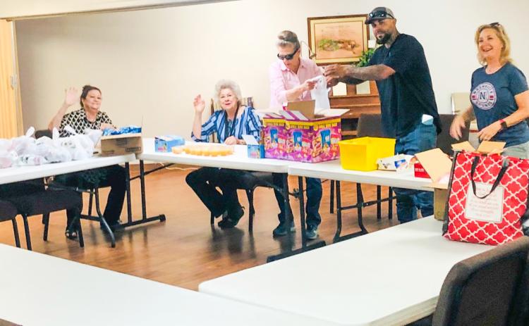 Wellington Lions assemble weekly Snack Packs for Seniors