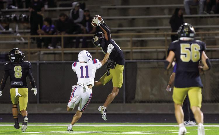 Childress’ Elliot Theparrukkul attempts to stop an interception by Canadian defensive back C.J. Jimenez during a district championship matchup Friday, Nov. 7 at Wildcat Stadium in Canadian. Press Pass Sports/Carter Pirtle