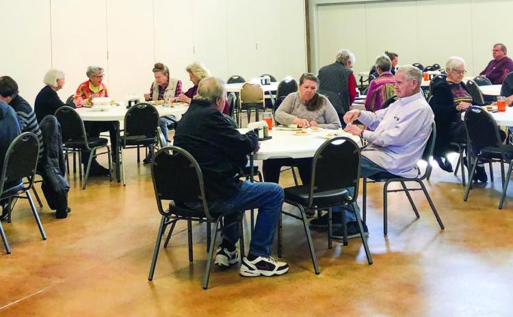 Collingsworth County citizens over 60 years of age gather at the Senior Community Café for its first day of dine-in food service. The 60 registered participants are invited to participate in the soft opening from 11:30 a.m. to 12:30 p.m. through Friday, Dec. 2. Beginning Monday, Dec. 5, anyone in the community can come and eat whether registered for the program or not, and whether they are 60 years old or not. The Red River Sun/Bev Odom