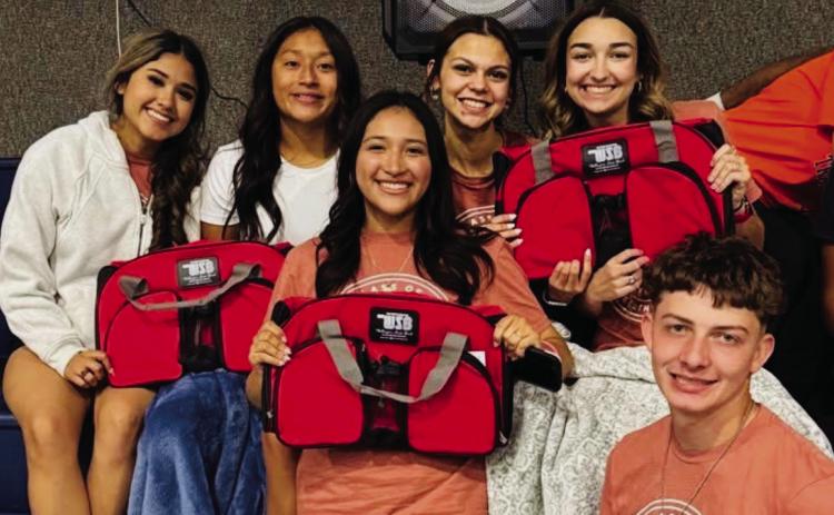 Each Wellington High School Class of 2025 graduate receives a duffle bag, compliments of Wellington State Bank, during the Friday, May 16 Project Graduation all-night party at the Wellington Activity Center (WAC). The students extend their heartfelt thanks to all the sponsors who helped make Project Celebration a tremendous success. Front row, from left: Christell Melendez, Carvin Wischkaemper. Second row, from left: Lisette Vela, Leslie Rodriguez, Kendra Molina, Gracie Lampe. Courtesy Photo