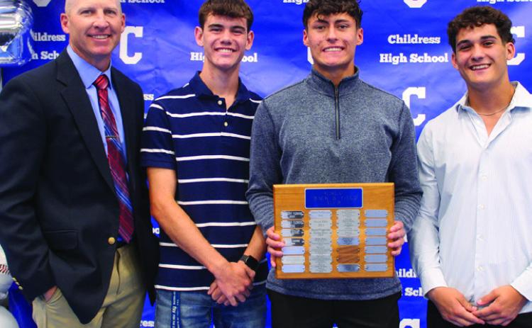 Boys’ head track coach Lee Brandon, left, awards Bobcat Track Co-Most Valuable Players (MVPs) Gavin Navarette, second from right, and Conner Keys, second from left, and Bobcat Field MVP Colton Teichelman, right.
