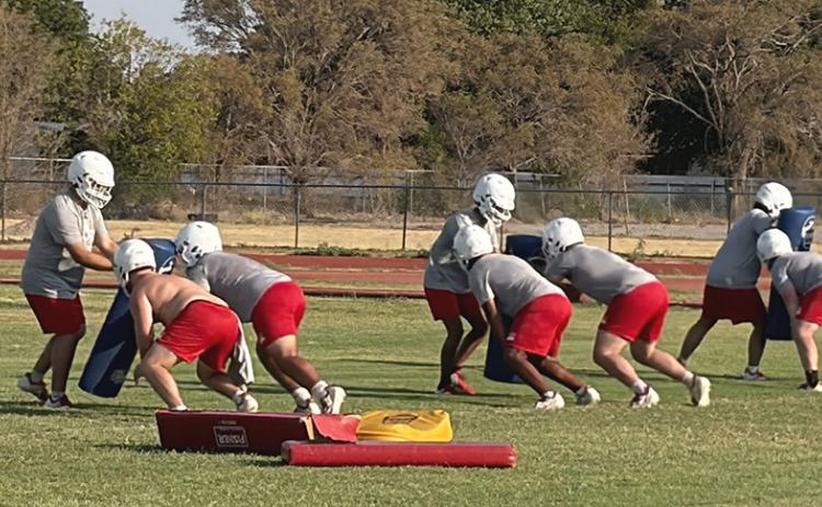 Ranked #10 in Dave Campbell Texas Football High School Ranking, Coach Joe Jones directs the Wellington Skyrocket offensive and defensive linemen during opening week workouts on Tuesday morning, Aug. 4, zooming headlong into the 2026 season. INTREPID PHOTO / BEV ODOM