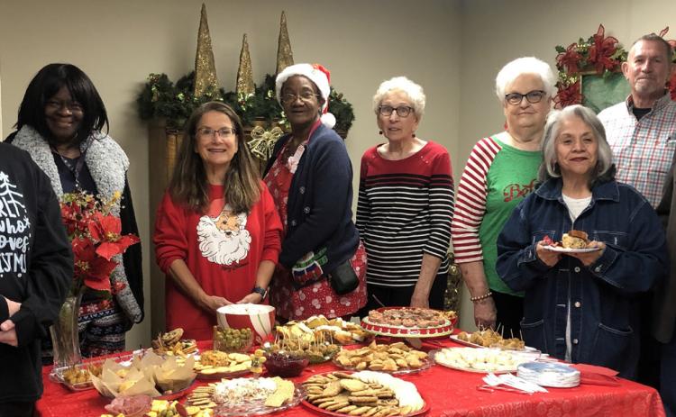 The Red River Sun/Bev Odom Collingsworth County Museum Director Karen Caldwell and the Board of Directors welcome visitors for a Christmas Open House from 11 a.m.-4 p.m. Friday, Dec. 15 in the Ellis Art Center. From left: Emily Cantu, Mary White, Caldwell, Janie Brooks, Lameda Black, Nancy Harris, Lucinda Martindale, Jeff Thomas, Scot Martindale.