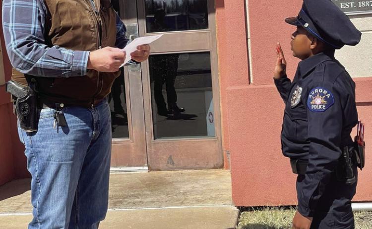 Childress County Sheriff Matthew Bradley swears in 11-year-old Devarjaye “DJ” Daniel, who is battling terminal brain and spinal cancer, Saturday, April 1. Photos Courtesy of Matthew Bradley