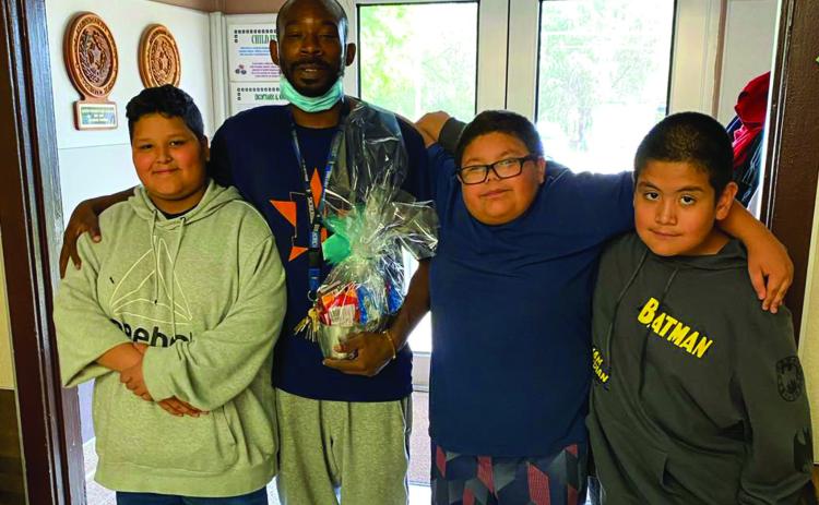 Austin Elementary School students Miguel Espinoza, Francisco Escovedo and Ayden Lucero thank custodian Anthony Johnson. Photos Courtesy of Memphis ISD