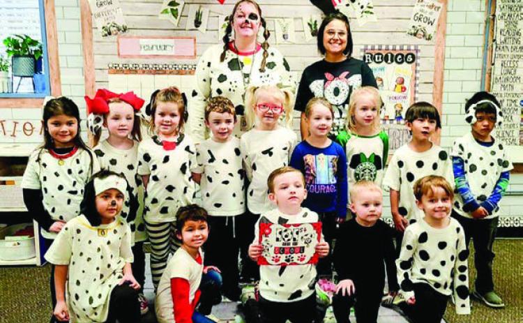 Wellington Head Start teacher Rhae Jones’ students dress as the “101 Dalmations,” with assistants Paige Owen and Marci Peters.
